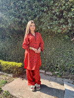 Zar Rust premium summer outfit for women featuring a rich rust base with bold black print on Arabic lawn fabric.