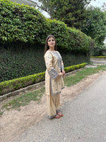 Side profile of Zarya 2PC embroidered beige suit set for women.