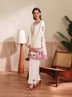 Cloothy Embroidered Collection featuring a model wearing a black and gold embroidered 2-piece lawn suit with intricate patterns.