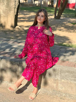 Model wearing Cloothy Midnight Pink embroidered lawn suit, perfect for festive occasions and casual gatherings.