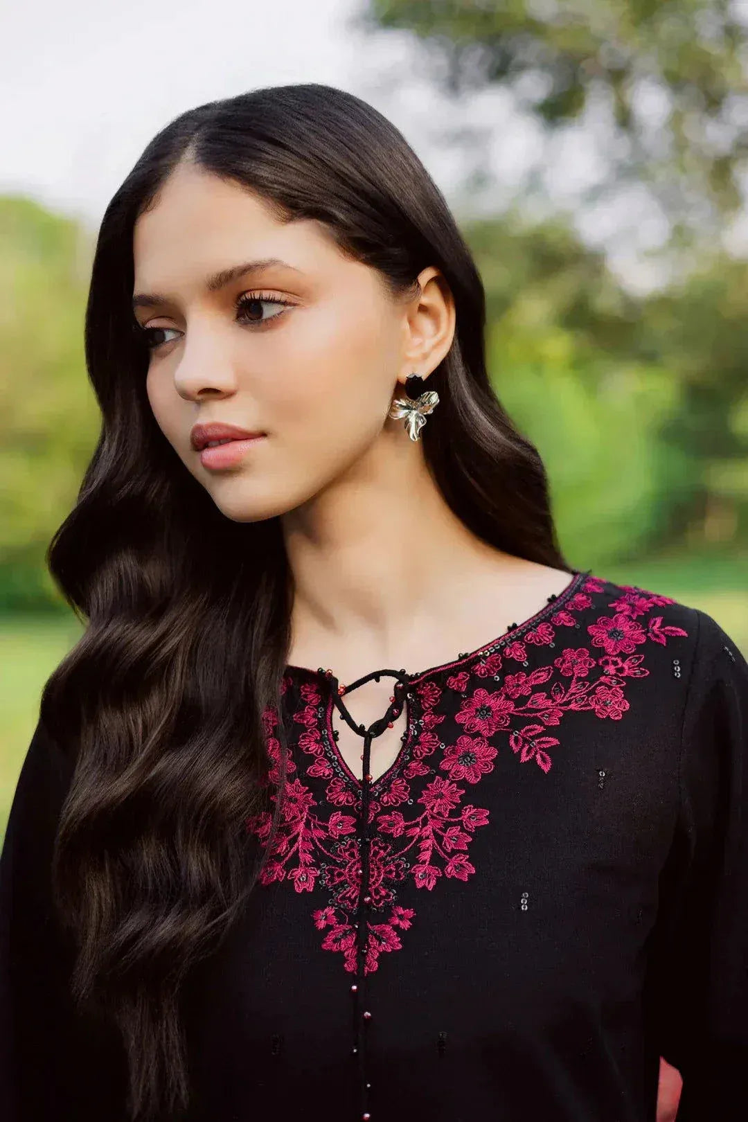Noara Zarnoir black 2-piece embroidered suit with intricate pink neckline detailing by Cloothy.
