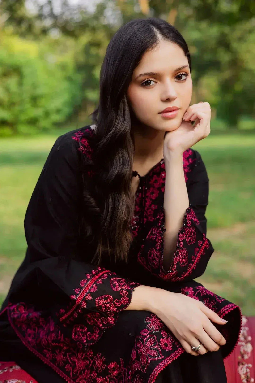 Close-up of the elegant pink embroidery on the Zarnoir black Arabic lawn suit shirt.