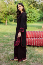 Noara Zarnoir black 2-piece embroidered suit with intricate pink neckline detailing by Cloothy.