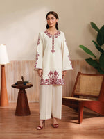 Cloothy Embroidered Collection featuring a model wearing a black and gold embroidered 2-piece lawn suit with intricate patterns.