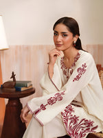 Cloothy Embroidered Collection featuring a model wearing a black and gold embroidered 2-piece lawn suit with intricate patterns.