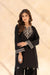 Full-length view of model wearing Cloothy Aylin black lawn suit with intricate embroidery.