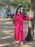 Model wearing Cloothy Midnight Pink embroidered lawn suit, perfect for festive occasions and casual gatherings.